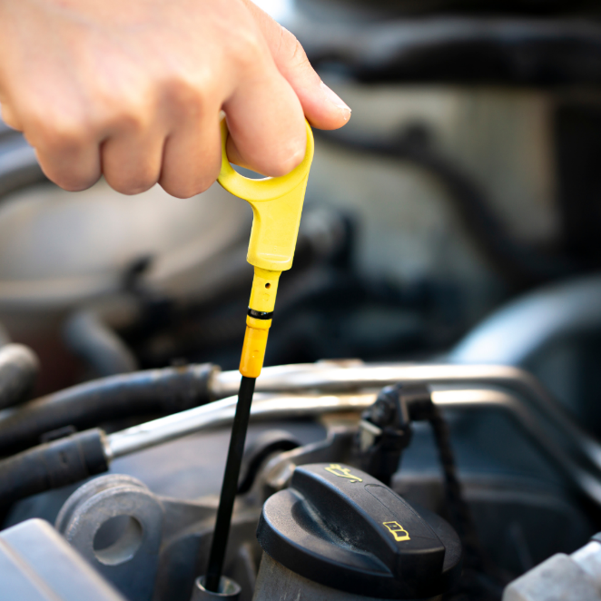 A hand holding a yellow tool
Description automatically generated